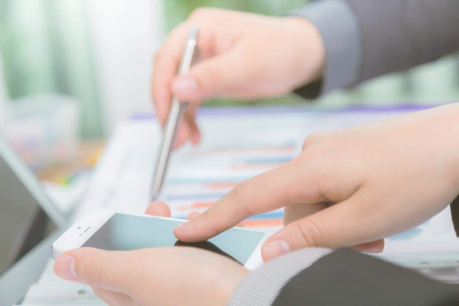 Students collaborating on financial analysis projects in workshop setting